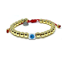 Cargar imagen en el visor de la galería, OCHRANA Pulsera ajustable de hematita dorada de 6mm con ojo turco de ceramica e hilo rojo de macramé
