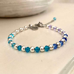 Pulsera ajustable de cristal facetado color azul y morado con hematita plateada