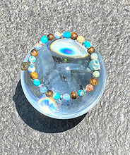 Cargar imagen en el visor de la galería, OCHRANA Pulsera elástica de 17.5 cm de piedra de jaspe y sedimento azul, ojo de tigre mate y hematita plateada con calavera de cerámica
